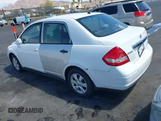 2007 Nissan Versa 1.8 S with VIN 3N1BC11E47L439072, listed as a IAAI auction lot 42083801 with 215,096 mi miles. Bid and sale history available at carsss.com. Image 3.