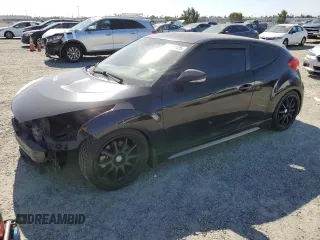 2014 Hyundai Veloster Turbo with VIN KMHTC6AE9EU204633, listed as a Copart auction lot 56981525 with 111,124 mi miles and Salvage title. Bid and sale history available at DreamBid. Image 1.