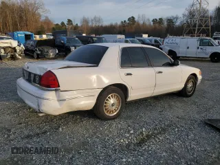 2000 Ford Crown Victoria Police Police Interceptor with VIN 2FAFP71W9YX101655, listed as a Copart auction lot 84666134 with 180,034 mi miles and Salvage Title. Bid and sale history available at carsss.com. Image 3.