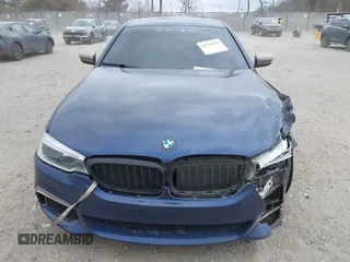 2018 BMW 5 Series M550i xDrive with VIN WBAJB9C56JG463891, listed as a IAAI auction lot 41731556 with 104,860 mi miles. Bid and sale history available at carsss.com. Image 12.