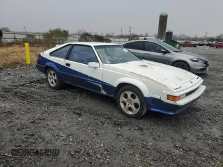 1984 Toyota Supra z VIN JT2MA67L5E0133497, wystawiony jako Copart lot #43439285 z przebiegiem 187 882 mil mil oraz Czysty tytuł • Clean title. Historia ofert i sprzedaży dostępna na DreamBid. Obrazek 4.