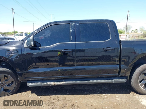 2023 Ford F-150 Lightning Pro with VIN 1FTVW1EV0PWG52297, listed as a IAAI auction lot 41730201 with 11,303 mi miles. Bid and sale history available at carsss.com. Image 14.