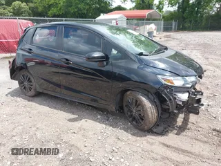 2018 Honda Fit Sport z VIN 3HGGK5H65JM706573, wystawiony jako IAAI lot #42293339 z przebiegiem 63 000 mil mil oraz . Historia ofert i sprzedaży dostępna na DreamBid. Obrazek 1.