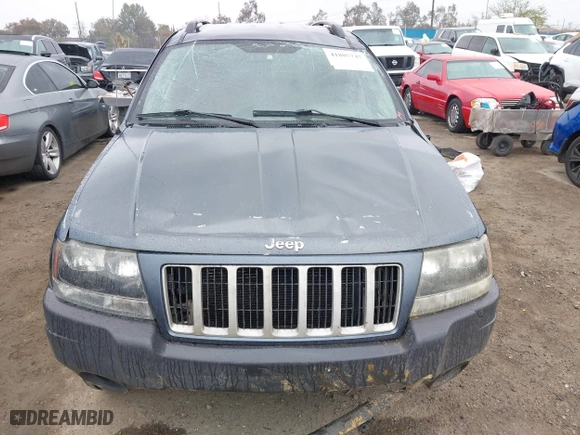 2004 Jeep Grand Cherokee Laredo with VIN 1J4GX48S64C291075, listed as a IAAI auction lot 41805747 with 282,384 mi miles. Bid and sale history available at carsss.com. Image 12.
