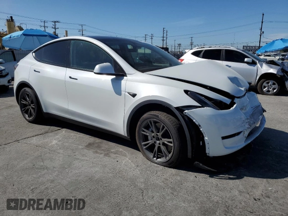 2024 Tesla Model Y with VIN 7SAYGDED5RF196309, listed as a Copart auction lot 44608545 with 7,226 mi miles and Salvage Title. Bid and sale history available at DreamBid. Image 4.
