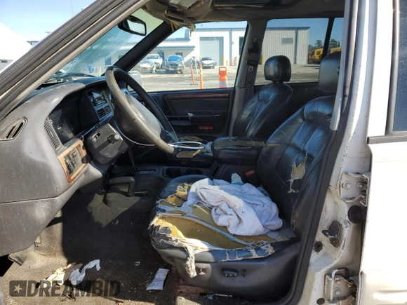 1998 Jeep Grand Cherokee Limited with VIN 1J4GZ78Y0WC307578, listed as a Copart auction lot 45272765 with 328,264 mi miles and Salvage title. Bid and sale history available at DreamBid. Image 7.