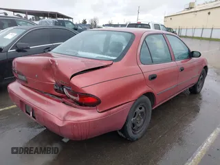 1997 Geo Prizm LSi with VIN 1Y1SK5265VZ457659, listed as a IAAI auction lot 41778510 with 149,073 mi miles. Bid and sale history available at carsss.com. Image 4.