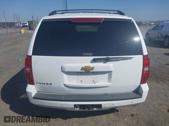 2014 Chevrolet Tahoe LT with VIN 1GNSCBE06ER233105, listed as a IAAI auction lot 41753190 with 161,056 mi miles and . Bid and sale history available at DreamBid. Image 16.