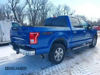 2015 Ford F-150 XLT with VIN 1FTEW1EG1FFA87638, listed as a IAAI auction lot 41597302 with 143,400 mi miles. Bid and sale history available at carsss.com. Image 4.