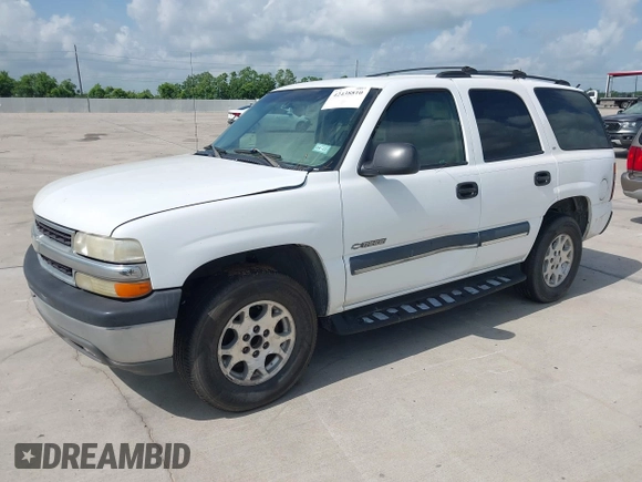 2002 Chevrolet Tahoe LS z VIN 1GNEC13Z42R214489, wystawiony jako IAAI lot #42438810 z przebiegiem 243 161 mil mil oraz . Historia ofert i sprzedaży dostępna na DreamBid. Obrazek 2.