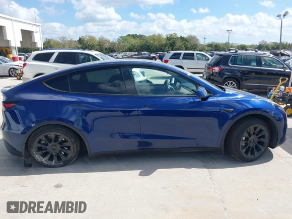 2023 Tesla Model Y Long Range with VIN 7SAYGDEE9PA205757, listed as a IAAI auction lot 41705881 with 18,567 mi miles and . Bid and sale history available at carsss.com. Image 13.