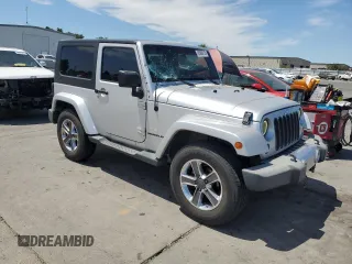 2009 Jeep Wrangler Sahara with VIN 1J4FA54149L708183, listed as a Copart auction lot 65989125 with 133,436 mi miles and Salvage title. Bid and sale history available at DreamBid. Image 4.