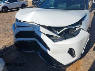 2023 Toyota RAV4 Hybrid XSE with VIN 2T3E6RFV1PW038080, listed as a IAAI auction lot 42518107 with 14,430 mi miles and . Bid and sale history available at DreamBid. Image 6.