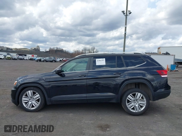 2019 Volkswagen Atlas SE z VIN 1V2UR2CA6KC580992, wystawiony jako IAAI lot #41902265 z przebiegiem 63 233 mil mil oraz . Historia ofert i sprzedaży dostępna na DreamBid. Obrazek 14.