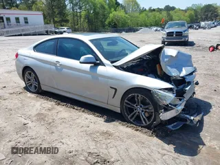 2014 BMW 4 Series 428i with VIN WBA3N7C50EK220438, listed as a IAAI auction lot 41990873 with 141,736 mi miles and . Bid and sale history available at carsss.com. Image 1.