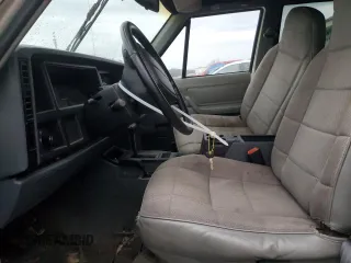 1996 Jeep Cherokee Sport with VIN 1J4FJ68S9TL284984, listed as a Copart auction lot 86307644 with 136,142 mi miles and Salvage Title. Bid and sale history available at carsss.com. Image 7.