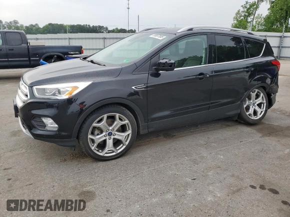 2019 Ford Escape Titanium with VIN 1FMCU0J95KUB14713, listed as a Copart auction lot 55887895 with 85,414 mi miles and Salvage title. Bid and sale history available at DreamBid. Image 1.