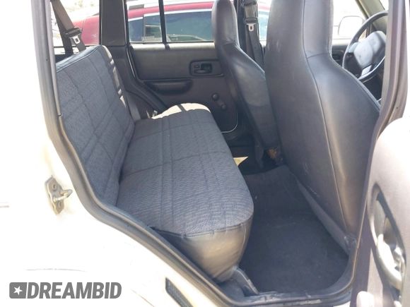 1999 Jeep Cherokee Sport with VIN 1J4FT68S1XL522018, listed as a IAAI auction lot 42551567 with 180,221 mi miles and . Bid and sale history available at DreamBid. Image 8.