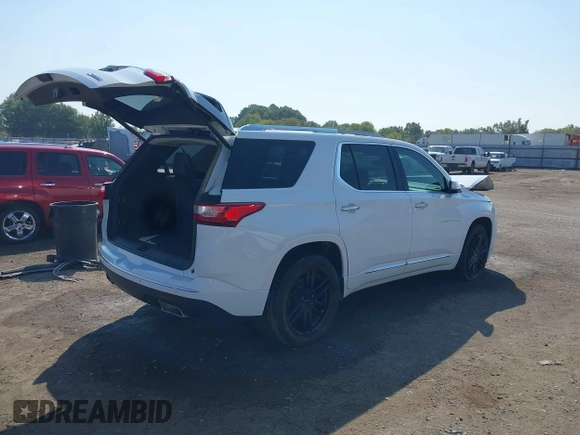 2018 Chevrolet Traverse Premier z VIN 1GNERKKW6JJ220965, wystawiony jako IAAI lot #37625637 z przebiegiem 99 072 mil mil oraz . Historia ofert i sprzedaży dostępna na DreamBid. Obrazek 4.