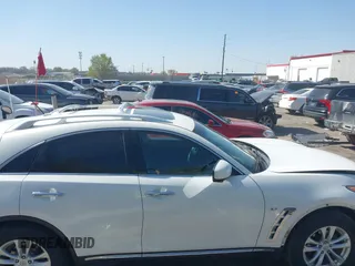 2014 Infiniti QX70 with VIN JN8CS1MW7EM413033, listed as a IAAI auction lot 41993136 with 148,838 mi miles and . Bid and sale history available at DreamBid. Image 14.