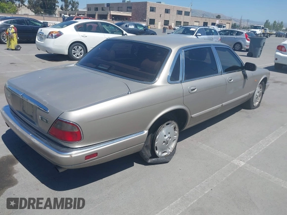 1997 Jaguar XJ with VIN SAJHX1243VC811674, listed as a IAAI auction lot 42333801 with 213,248 mi miles and . Bid and sale history available at DreamBid. Image 4.