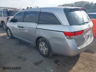 2015 Honda Odyssey LX with VIN 5FNRL5H27FB027143, listed as a IAAI auction lot 41239939 with 125,732 mi miles. Bid and sale history available at carsss.com. Image 3.