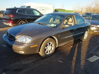 2003 Mercury Sable LS Premium with VIN 1MEFM55S03G606625, listed as a IAAI auction lot 41070883 with 100,002 mi miles. Bid and sale history available at carsss.com. Image 2.