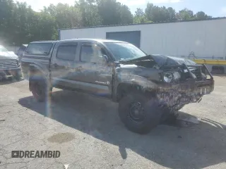 2014 Toyota Tacoma with VIN 3TMLU4EN2EM163797, listed as a Copart auction lot 61078805 with 130,748 mi miles and Salvage title. Bid and sale history available at DreamBid. Image 4.