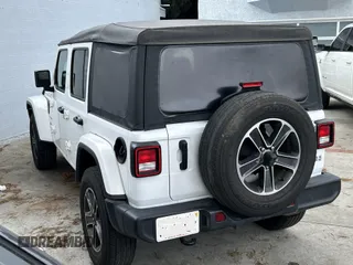 2023 Jeep Wrangler Sahara with VIN 1C4HJXENXPW586579, listed as a IAAI auction lot 41795621 with 34,433 mi miles. Bid and sale history available at carsss.com. Image 3.