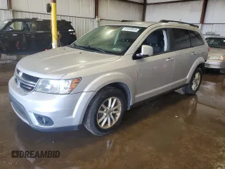2013 Dodge Journey SXT with VIN 3C4PDDBG2DT535831, listed as a Copart auction lot 61649645 with 242,064 mi miles and Salvage title. Bid and sale history available at DreamBid. Image 1.