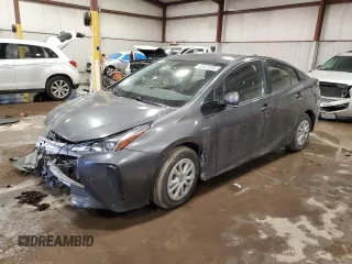 2019 Toyota Prius L Eco z VIN JTDKARFU3K3073515, wystawiony jako Copart lot #42521205 z przebiegiem Nie podano mil oraz Szkoda całkowita • Salvage title. Historia ofert i sprzedaży dostępna na DreamBid. Obrazek 1.