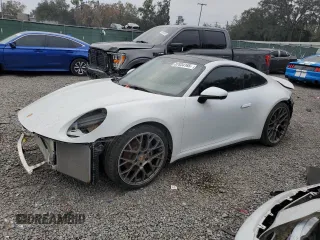 2020 Porsche 911 Carrera with VIN WP0AA2A9XLS205571, listed as a Copart auction lot 87834165 with 27,077 mi miles and Salvage Title. Bid and sale history available at carsss.com. Image 1.