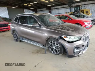 2020 BMW X1 xDrive28i with VIN WBXJG9C05L5R40935, listed as a Copart auction lot 47145335 with 46,554 mi miles and Salvage Title. Bid and sale history available at carsss.com. Image 4.
