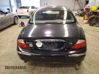 2003 Jaguar S-Type z VIN SAJEA01U93HM84195, wystawiony jako Copart lot #54300574 z przebiegiem 98 820 mil mil oraz Czysty tytuł • Clean title. Historia ofert i sprzedaży dostępna na DreamBid. Obrazek 6.
