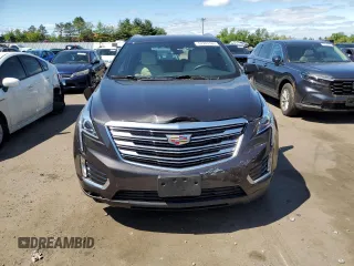 2018 Cadillac XT5 AWD with VIN 1GYKNBRS8JZ203963, listed as a Copart auction lot 57243165 with 18,407 mi miles and Salvage title. Bid and sale history available at DreamBid. Image 5.