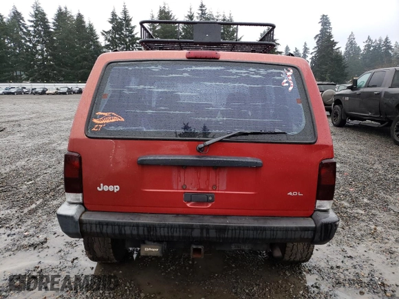 1999 Jeep Cherokee SE with VIN 1J4FF28S9XL645291, listed as a Copart auction lot 87064124 with Not provided miles and Salvage title. Bid and sale history available at DreamBid. Image 6.