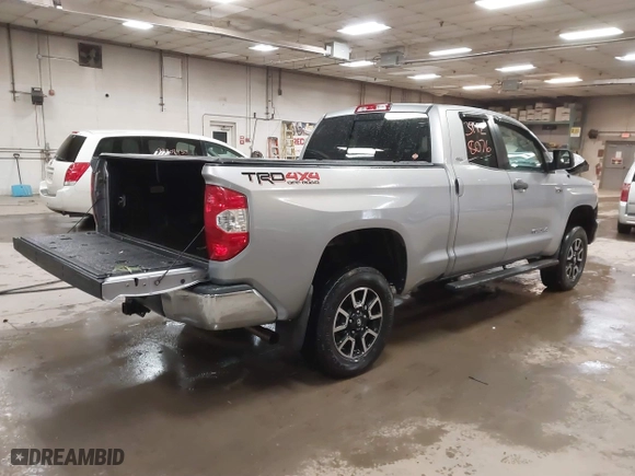 2014 Toyota Tundra 4WD Truck SR with VIN 5TFUY5F17EX357035, listed as a IAAI auction lot 39928076 with 129,831 mi miles. Bid and sale history available at carsss.com. Image 4.