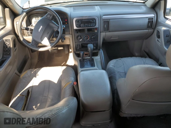 2004 Jeep Grand Cherokee Laredo z VIN 1J4GW48S74C159381, wystawiony jako Copart lot #53972115 z przebiegiem 128 309 mil mil oraz Szkoda całkowita • Salvage title. Historia ofert i sprzedaży dostępna na DreamBid. Obrazek 8.