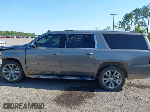 2019 Chevrolet Suburban LT with VIN 1GNSCJKC3KR129739, listed as a IAAI auction lot 42044708 with 105,771 mi miles and . Bid and sale history available at DreamBid. Image 14.