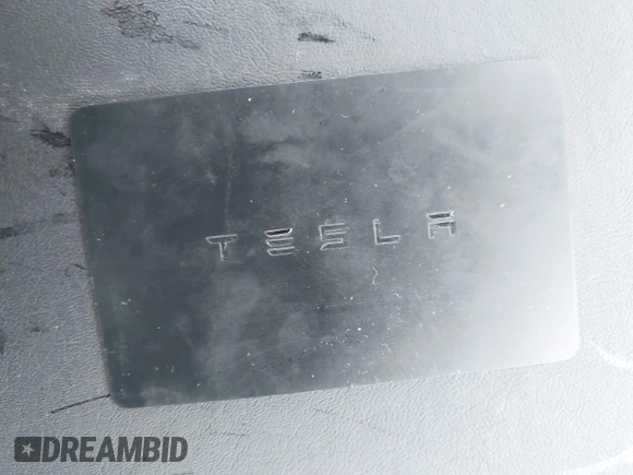 2019 Tesla Model 3 Mid Range z VIN 5YJ3E1EA7KF299755, wystawiony jako IAAI lot #42354352 z przebiegiem Nie podano mil oraz . Historia ofert i sprzedaży dostępna na DreamBid. Obrazek 9.