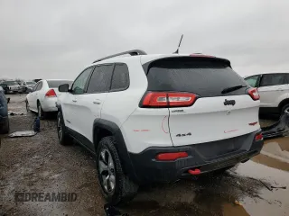 2015 Jeep Cherokee Trailhawk with VIN 1C4PJMBS9FW605075, listed as a Copart auction lot 49256195 with 103,677 mi miles and Salvage Title. Bid and sale history available at DreamBid. Image 2.