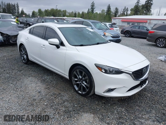 2017 Mazda 6 Grand Touring with VIN JM1GL1X51H1142473, listed as a IAAI auction lot 42234809 with 101,633 mi miles and . Bid and sale history available at DreamBid. Image 1.