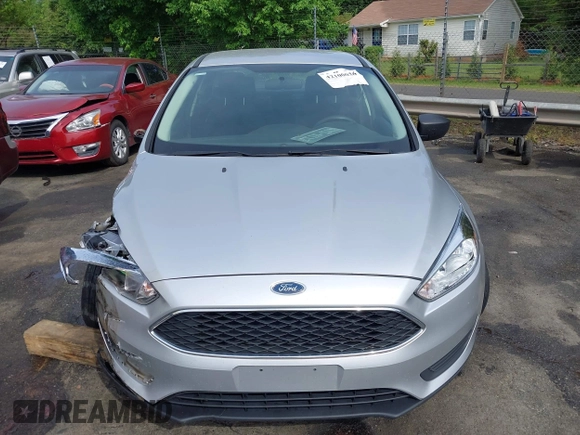 2017 Ford Focus S z VIN 1FADP3E21HL241557, wystawiony jako IAAI lot #42100036 z przebiegiem 106 764 mil mil oraz . Historia ofert i sprzedaży dostępna na DreamBid. Obrazek 12.