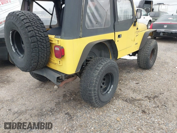 2000 Jeep Wrangler Sport with VIN 1J4FA49S0YP781831, listed as a IAAI auction lot 41694680 with 250,108 mi miles and . Bid and sale history available at DreamBid. Image 4.