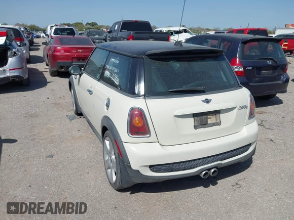 2007 MINI Hardtop S with VIN WMWMF73527TT82098, listed as a IAAI auction lot 41828664 with 107,418 mi miles and . Bid and sale history available at DreamBid. Image 3.