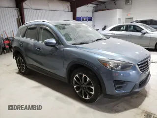 2016 Mazda CX-5 Grand Touring with VIN JM3KE4DY1G0714674, listed as a Copart auction lot 75516524 with 115,766 mi miles and Salvage Title. Bid and sale history available at carsss.com. Image 4.
