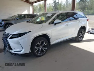 2021 Lexus RX with VIN JTJHZKFA2M2030841, listed as a IAAI auction lot 42009263 with 38,113 mi miles. Bid and sale history available at carsss.com. Image 2.