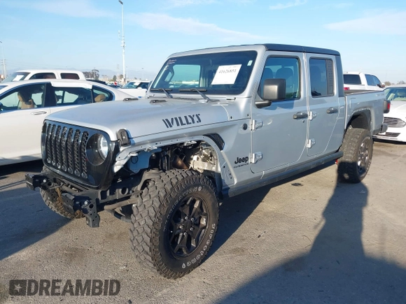 2022 Jeep Gladiator Willys with VIN 1C6HJTAG4NL132558, listed as a IAAI auction lot 41626851 with 28,251 mi miles and . Bid and sale history available at DreamBid. Image 2.