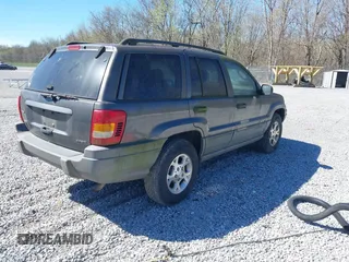 2002 Jeep Grand Cherokee z VIN 1J4GX38S92C149908, wystawiony jako IAAI lot #41782530 z przebiegiem 145 195 mil mil oraz . Historia ofert i sprzedaży dostępna na DreamBid. Obrazek 4.