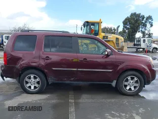 2009 Honda Pilot Touring with VIN 5FNYF48959B007813, listed as a IAAI auction lot 41823645 with 200,571 mi miles and . Bid and sale history available at carsss.com. Image 13.